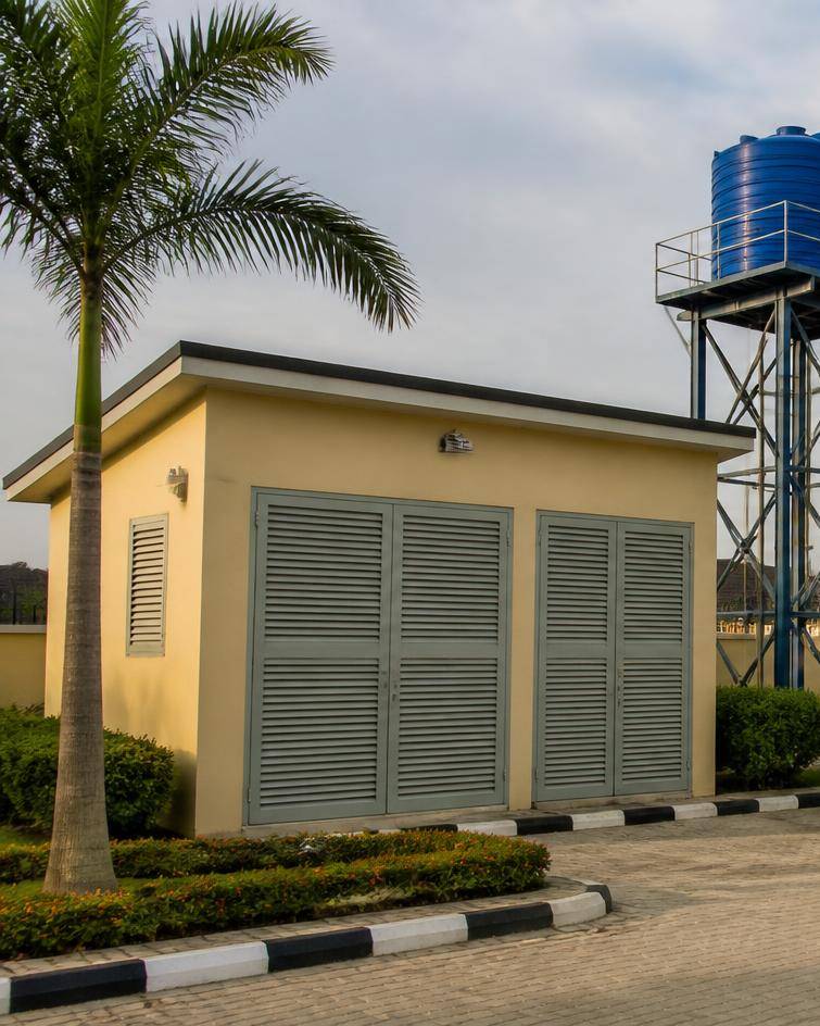 Estate utilities compound with a plant house, water tank tower and treatment plant